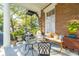 Inviting front porch with seating and lush landscaping at 12 Bee Street St # A, Charleston, SC 29403