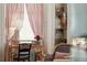 Bright home office with antique desk and chair near window at 12 Bee Street St # A, Charleston, SC 29403