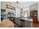 Bright kitchen boasts stainless steel appliances and a granite island at 12 Bee Street St # A, Charleston, SC 29403