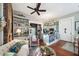 Open living area with exposed brick wall and hardwood floors at 12 Bee Street St # A, Charleston, SC 29403