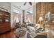 Spacious living room features exposed brick and comfortable seating at 12 Bee Street St # A, Charleston, SC 29403