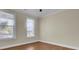 Bright bedroom with hardwood floors and two large windows at 1201 Roma Rd, Hanahan, SC 29410