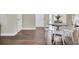 Small dining area with white chairs and a round wooden table at 1201 Roma Rd, Hanahan, SC 29410