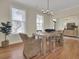 Bright dining room with hardwood floors and a rustic wooden table at 1201 Roma Rd, Hanahan, SC 29410