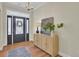 Bright and airy entryway with hardwood floors and a console table at 1201 Roma Rd, Hanahan, SC 29410