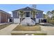 Two-story house with gray siding, white trim, and a large front porch at 1201 Roma Rd, Hanahan, SC 29410