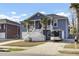Two-story house with gray siding, white trim, and a large front porch at 1201 Roma Rd, Hanahan, SC 29410