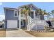 Two-story house with gray siding, white trim, and a large front porch at 1201 Roma Rd, Hanahan, SC 29410