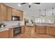 Open kitchen with stainless steel appliances and a view of the living room at 1201 Roma Rd, Hanahan, SC 29410