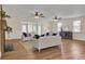 Spacious living room featuring hardwood floors, two sofas, and a fireplace at 1201 Roma Rd, Hanahan, SC 29410