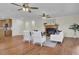 Open living room with hardwood floors and a view into the kitchen area at 1201 Roma Rd, Hanahan, SC 29410