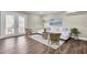 Living room with hardwood floors, white couch, and French doors to patio at 1201 Roma Rd, Hanahan, SC 29410