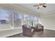 Bright sunroom with wicker chairs and view at 1201 Roma Rd, Hanahan, SC 29410