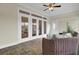 Sunroom with wicker furniture and tiled floors, providing access to the outdoors at 1201 Roma Rd, Hanahan, SC 29410