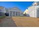 Spacious backyard with screened porch and grassy area at 128 Sandy Bend Ln, Summerville, SC 29486