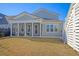 Screened porch and fenced backyard with open grassy area at 128 Sandy Bend Ln, Summerville, SC 29486