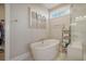 Spa-like bathroom with soaking tub, walk in shower, and art at 128 Sandy Bend Ln, Summerville, SC 29486