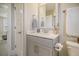 Modern bathroom with gray vanity, white countertop, and a large mirror at 128 Sandy Bend Ln, Summerville, SC 29486