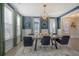 Elegant dining room with a statement light fixture and ample natural light at 128 Sandy Bend Ln, Summerville, SC 29486