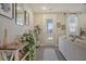 Light and airy entryway with console table and view to backyard at 128 Sandy Bend Ln, Summerville, SC 29486