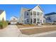 Two story house with front porch and landscaped yard at 128 Sandy Bend Ln, Summerville, SC 29486