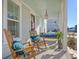 Relaxing front porch with rocking chairs and porch swing at 128 Sandy Bend Ln, Summerville, SC 29486