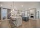 Modern kitchen boasts a large island, stainless steel appliances, and white cabinets at 128 Sandy Bend Ln, Summerville, SC 29486