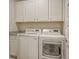 Laundry room with white cabinets and matching LG washer and dryer at 128 Sandy Bend Ln, Summerville, SC 29486