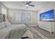 Serene bedroom with comfortable bed and large TV at 128 Sandy Bend Ln, Summerville, SC 29486