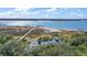 Aerial view showcasing home's location on waterfront property with private dock at 153 Dewees Inlet Dr, Dewees Island, SC 29451