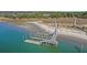 Aerial view of waterfront property with private dock and expansive marsh views at 153 Dewees Inlet Dr, Dewees Island, SC 29451