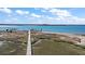 Panoramic view of waterfront property with long boardwalk and multiple boat docks at 153 Dewees Inlet Dr, Dewees Island, SC 29451