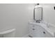 Clean bathroom with white vanity and marble countertop at 153 Dewees Inlet Dr, Dewees Island, SC 29451