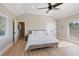 Comfortable bedroom with light hardwood floors and water views at 153 Dewees Inlet Dr, Dewees Island, SC 29451