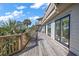 Long wooden deck with built-in grill and ocean views at 153 Dewees Inlet Dr, Dewees Island, SC 29451