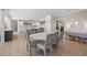 Elegant dining room with oval table and access to kitchen at 153 Dewees Inlet Dr, Dewees Island, SC 29451