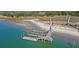 Private boat dock with multiple slips and a long boardwalk at 153 Dewees Inlet Dr, Dewees Island, SC 29451