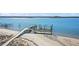 Wooden walkway leads to a private boat dock on the water at 153 Dewees Inlet Dr, Dewees Island, SC 29451