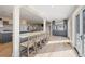 Open kitchen with breakfast bar and access to outdoor deck at 153 Dewees Inlet Dr, Dewees Island, SC 29451