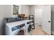 Laundry room with washer, dryer, and additional toilet at 153 Dewees Inlet Dr, Dewees Island, SC 29451