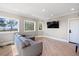 Bright living room with hardwood floors and water views at 153 Dewees Inlet Dr, Dewees Island, SC 29451