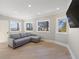 Light-filled living area with hardwood floors and water views at 153 Dewees Inlet Dr, Dewees Island, SC 29451