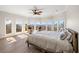 Spacious main bedroom with water views and light hardwood floors at 153 Dewees Inlet Dr, Dewees Island, SC 29451