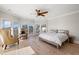 Bright bedroom with hardwood floors, a ceiling fan, and access to a deck at 153 Dewees Inlet Dr, Dewees Island, SC 29451