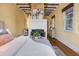 Bedroom with exposed beams, fireplace, and hardwood floors at 157 Line St, Charleston, SC 29403