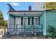 Quaint front porch with small table and chairs, perfect for relaxing at 157 Line St, Charleston, SC 29403