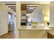 Kitchen with granite countertop and a view into the living room and bedroom at 157 Line St, Charleston, SC 29403