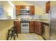 Small, well-equipped kitchen with stainless steel appliances and granite countertops at 157 Line St, Charleston, SC 29403