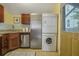 Galley kitchen with stainless steel appliances and washer/dryer at 157 Line St, Charleston, SC 29403