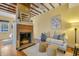 Living room with exposed beams, comfortable seating, and hardwood floors at 157 Line St, Charleston, SC 29403